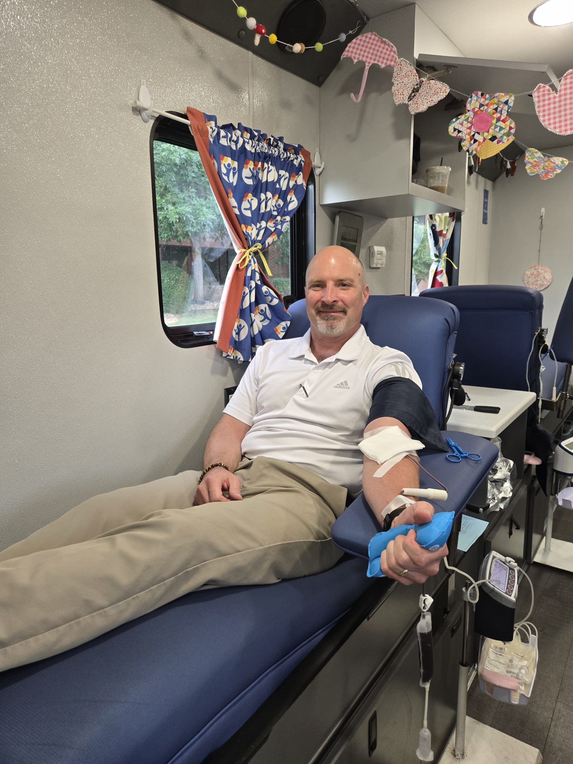 Kevin Rohr, Encore Electric Critical Projects Manager, donating blood at company blood drive. 