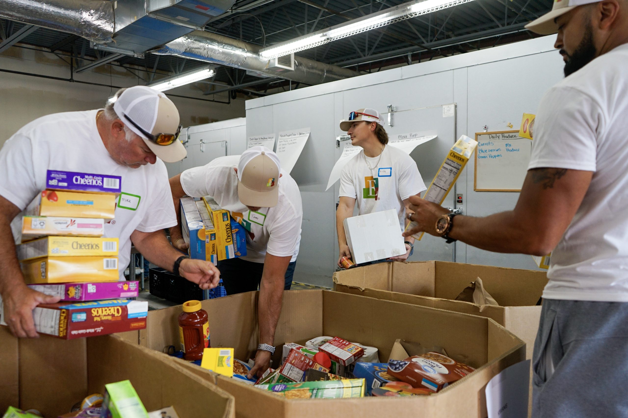 Encore Gives! Day volunteers sorting food at The Action Center
